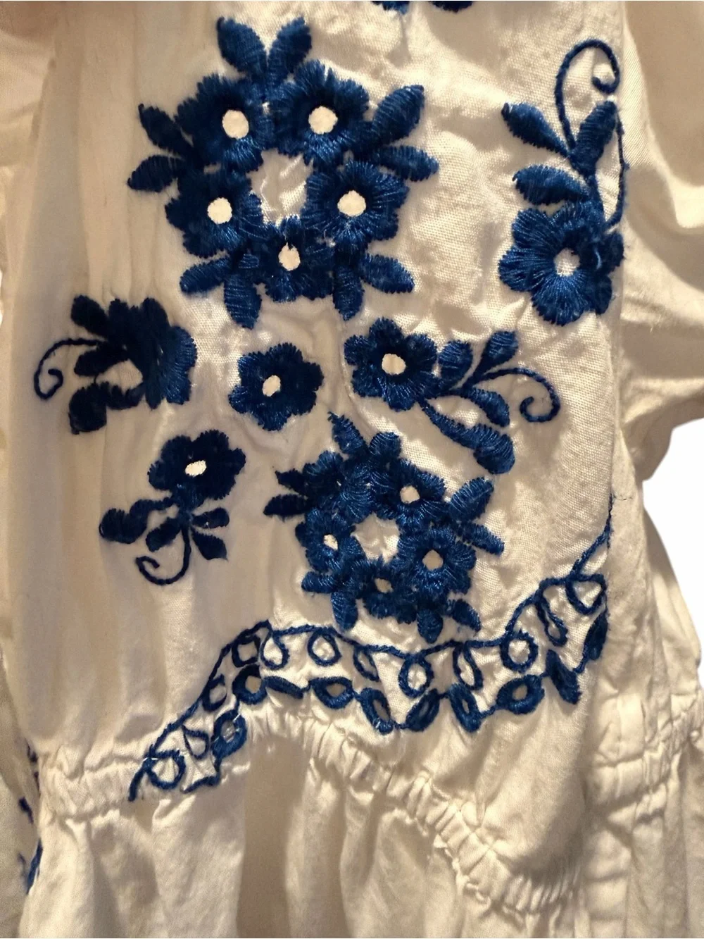 Anthropologie White Babydoll Top with Blue Embroidered Floral Detail Medium